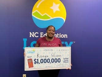 Kenya Sloan of Shelby picks up her $1 million lottery win at the North Carolina Education Lottery headquarters in Raleigh.