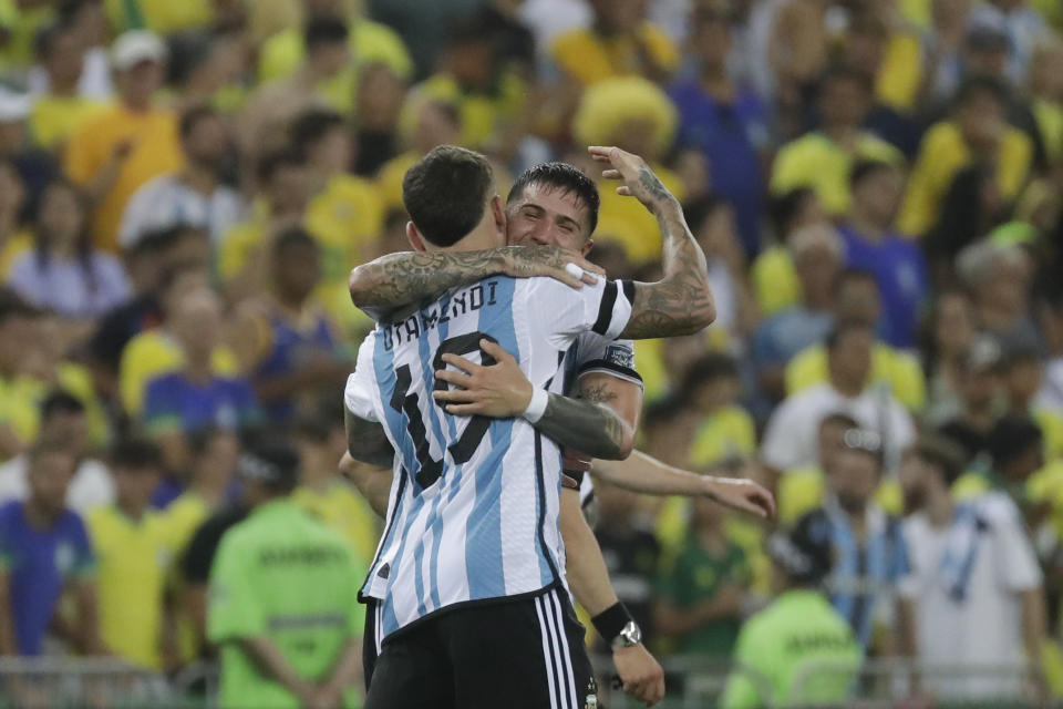 Argentina's Nicolas Otamendi, left, celebrates with teammate Enzo Fernandez after scoring his side's opening goal against Brazil during a qualifying soccer match for the FIFA World Cup 2026 at Maracana stadium in Rio de Janeiro, Brazil, Tuesday, Nov. 21, 2023. (AP Photo/Bruna Prado)