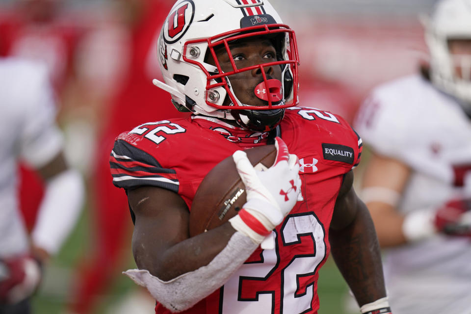 FILE - In this Dec. 19, 2020, file photo, Utah running back Ty Jordan (22) scores against Washington State during the second half of an NCAA college football game, in Salt Lake City. Authorities say Jordan died at a hospital in the Dallas area after accidently shooting himself. University officials announced Ty Jordan’s death Saturday, the day after he was named Pac-12’s newcomer of the year. (AP Photo/Rick Bowmer, File)