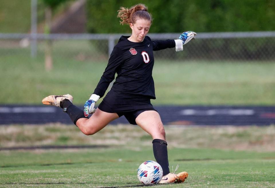 South Meck’s goalie Lilly Heaslet kicks the ball into play during the varsity women’s soccer game against Myers Park on Friday, April, 19, 2024.