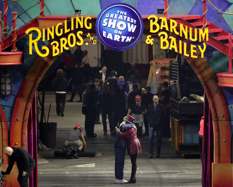 <p>Ringmaster Kristen Michelle Wilson, right, hugs a member of the crew after the red unit’s final performance, Sunday, May 7, 2017, in Providence, R.I. For the performers who travel with the Ringling Bros. and Barnum & Bailey Circus, its demise means the end of a unique way of life for hundreds of performers and crew members. (Photo: Julie Jacobson/AP) </p>