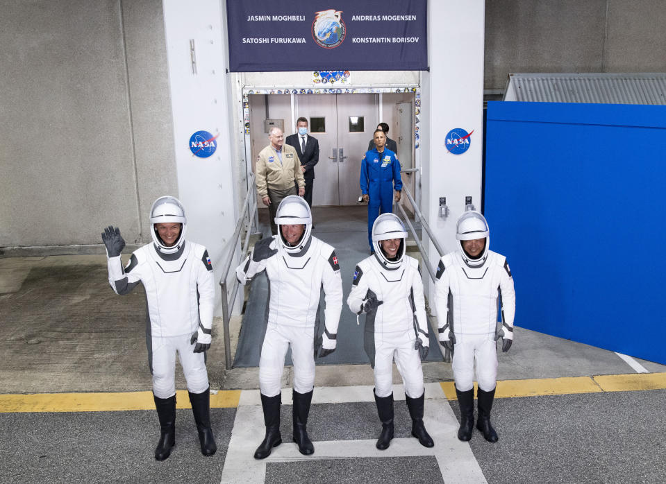 Russian cosmonaut Konstantin Borisov, Danish astronaut Andreas Mogensen, NASA astronaut Jasmin Moghbeli and Japanese astronaut Satoshi Furukawa, from left, prepare to leave the Operations and Checkout Building early Saturday, Aug. 26, 2023, before heading to the launch pad to board the SpaceX Falcon 9 rocket on a mission to the International Space Station, in Cape Canaveral, Fla. (Joel Kowsky/NASA via AP)