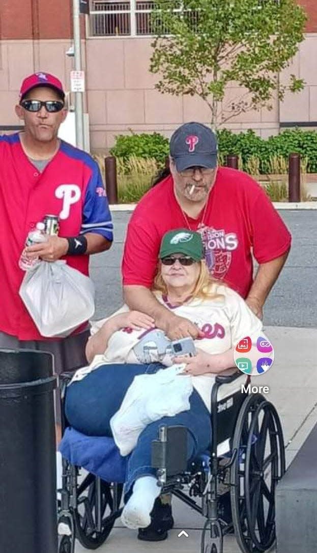 Joe Hocher (far left) with his friends Ken Sandy (center) and Linda Romberger at a Philadelphia Phillies game last year.
