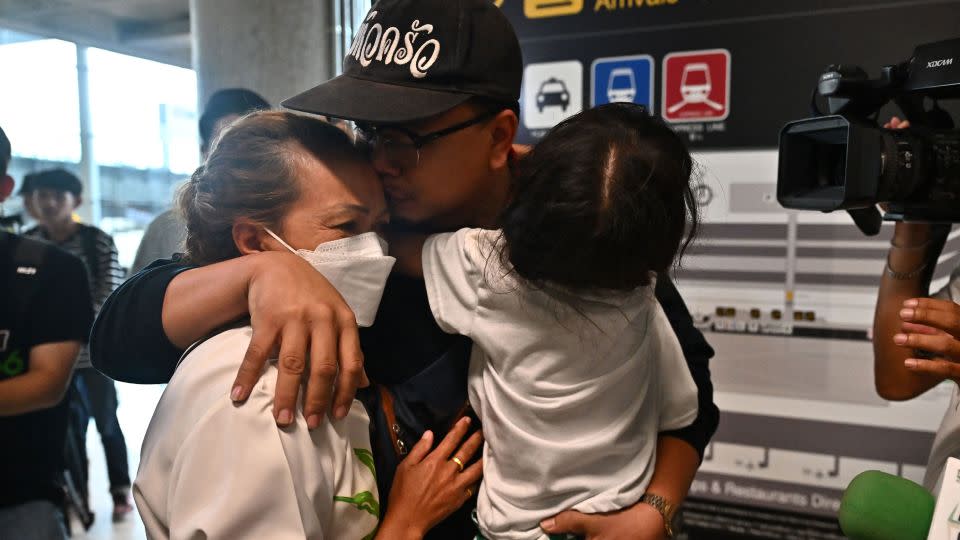 Emotional scenes at Bangkok's Suvarnabhumi International Airport in Bangkok on October 12 as Thais returning from Israel were reunited with anxious loved ones - Lillian Suwanrumpha/AFP/Getty Images