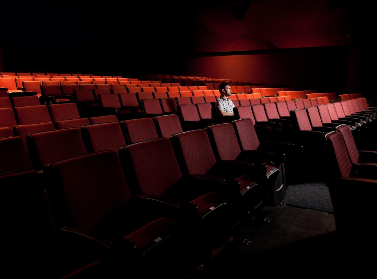 One Man in an Empty Theater stock photo