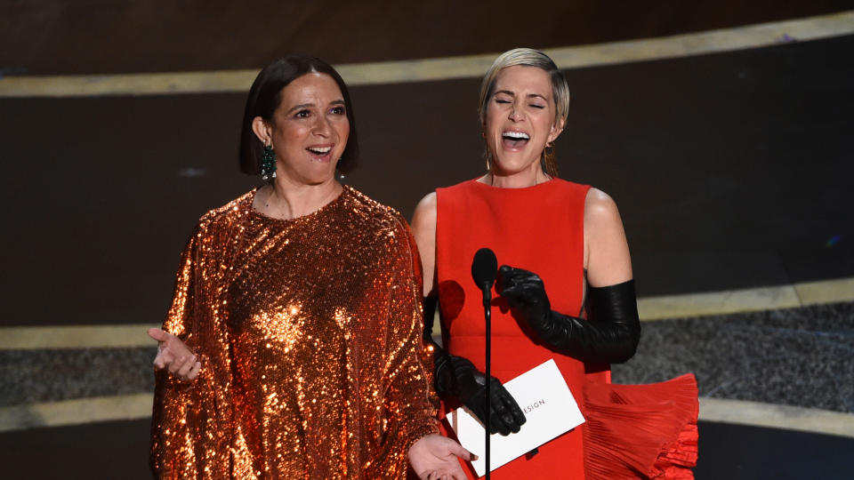 Maya Rudolph, left, and Kristen Wiig at the Oscars on Sunday, Feb. 9, 2020. (AP Photo/Chris Pizzello)