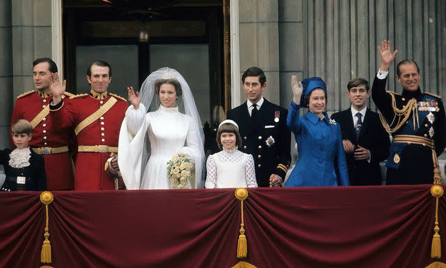 <p>Anwar Hussein/Getty</p> Queen Elizabeth wears blue at Princess Anne's wedding in 1973