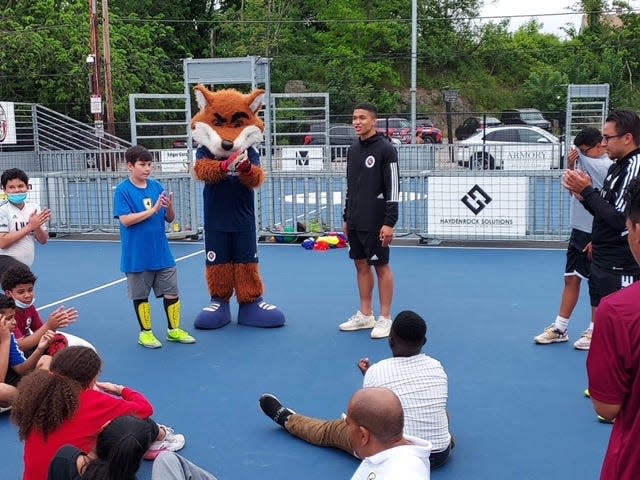 Damian Rivera, of the New England Revolution, talks to the kids at a Project GOAL event, a city nonprofit with a combined focus on academics and athletics.