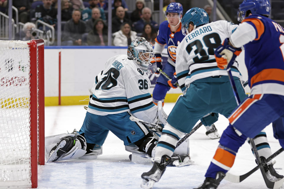 San Jose Sharks goaltender Kaapo Kahkonen looks back at the net after New York Islanders center Brock Nelson scored a goal during the second period of an NHL hockey game Tuesday, Dec. 5, 2023, in Elmont, N.Y. (AP Photo/Adam Hunger)