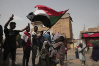 Anti-military protesters march on Friday, July 1, 2022 in Khartoum, Sudan, a day after nine people were killed in demonstrations against the country’s ruling generals. (AP Photo/Marwan Ali)