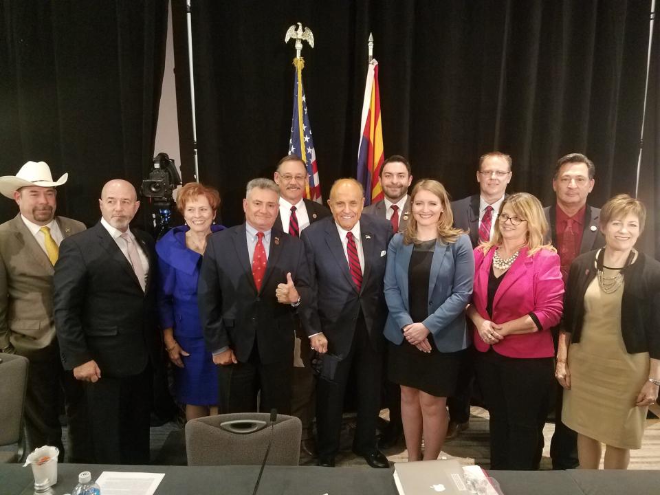 Rudy Giuliani poses with Arizona lawmakers on Nov. 30, 2020. (@SonnyBorrelli/Twitter)