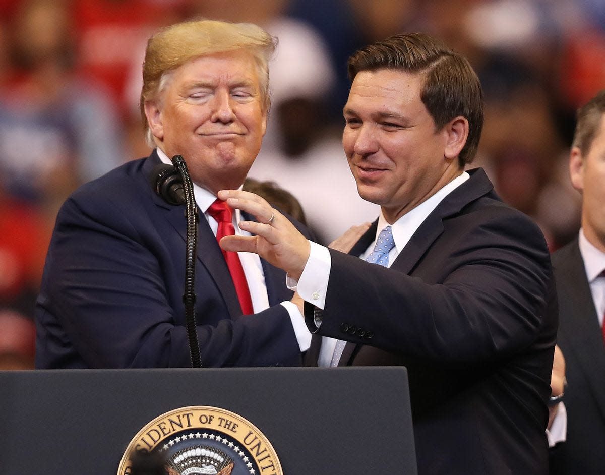 Former President Donald Trump and Florida Gov. Ron DeSantis and in happier days.