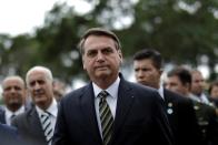 Brazil's President Jair Bolsonaro leaves the Planalto Palace to deliver the economic reform package to National Congress, in Brasilia