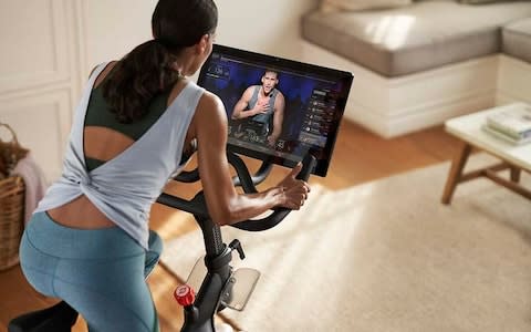 A woman rides the Peloton bike - Credit: Peloton/Peloton