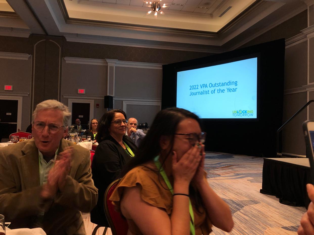 Joyce Chu, moments after the announcement she was the 2022 VPA Outstanding Journalist of the Year. Editor Jeff Schwaner leads the cheer.