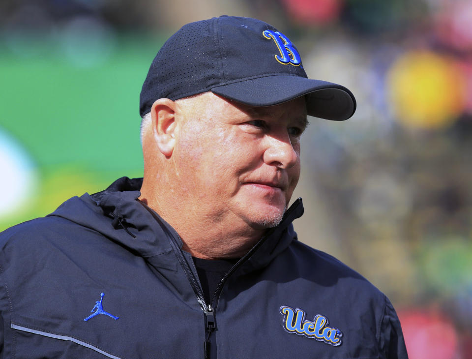 UCLA head coach Chip Kelly watches warmups before an NCAA college football game against Oregon Saturday, Oct. 22, 2022, in Eugene, Ore. (AP Photo/Chris Pietsch)