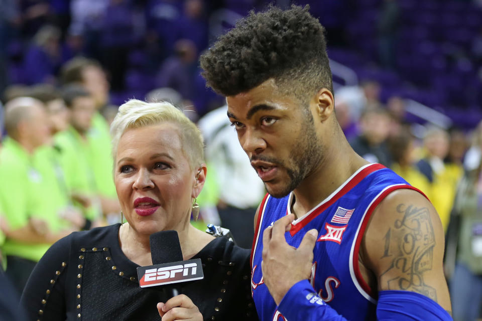 Holly Rowe, pictured with Kansas guard Frank Mason III in February, thanked ESPN for renewing her contract amid her cancer battle. (Photo: Icon Sportswire via Getty Images)