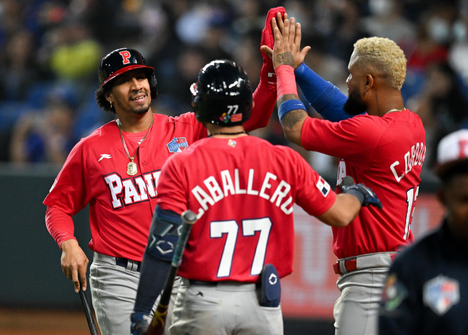 TAICHUNG, TAIWAN - MARCH 08: Jose Ramos #99 of Team Panama scores after Erasmo Caballero #98 of Team Panama hit a 2 RBI single at the top of the 6th inning during the World Baseball Classic Pool A game between Panama and Chinese Taipei at Taichung Intercontinental Baseball Stadium on March 08, 2023 in Taichung, Taiwan. (Photo by Gene Wang/Getty Images)