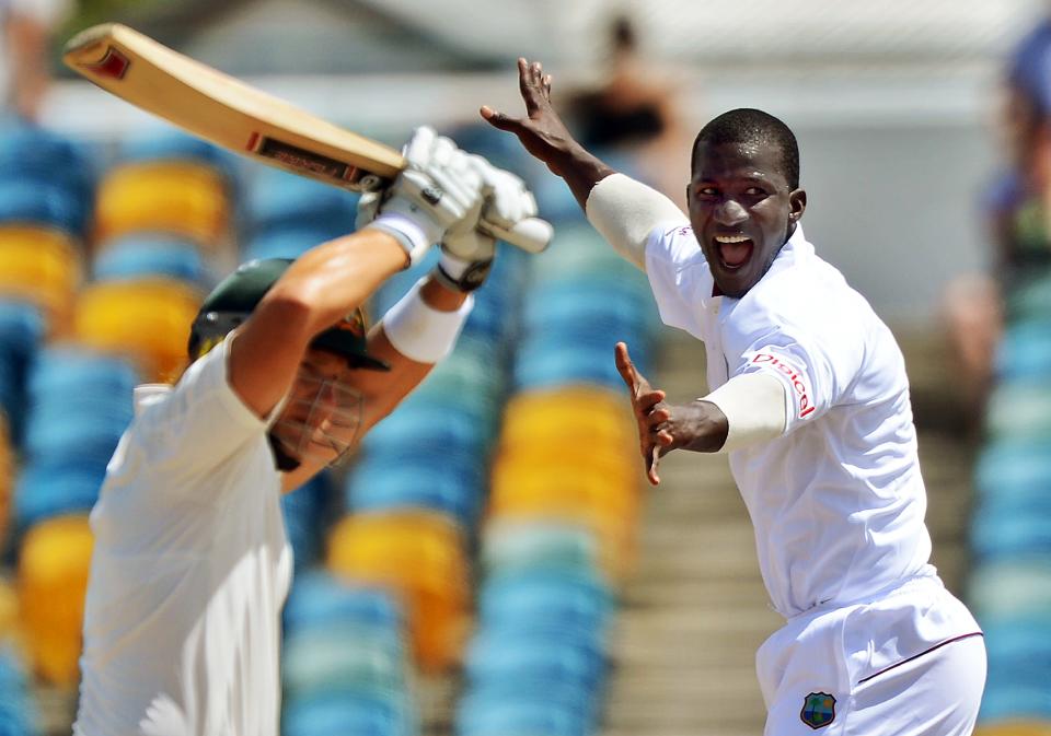 West Indies cricket team captain Darren Sammy (R) unsuccessfully appeal for a lbw against Australian batsman David Warner (L) during the third day of the first-of-three Test matches between Australia and West Indies at the Kensington Oval stadium in Bridgetown on April 9, 2012. West Indies scored of 449/9 at the end of their first innings. AFP PHOTO/Jewel Samad (Photo credit should read JEWEL SAMAD/AFP/Getty Images)