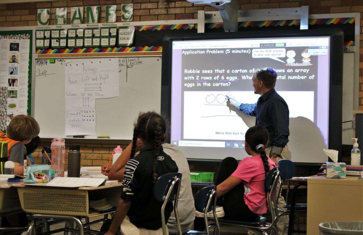 Logan McDowell teaches a math lesson to his third grade class at Sunset Elementary Aug. 17.