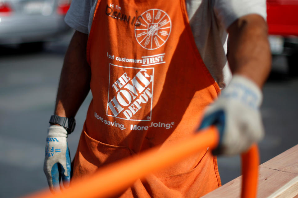 A Home Depot employee is seen outside a store in Los Angeles, California March 17, 2015. REUTERS/Lucy Nicholson/File Photo