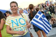 A supporter of the 'No' vote in the Greek referendum celebrates at Syntagma Square in Athens