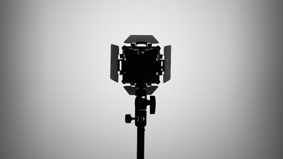 Zhiyun FIVERAY M20C LED panel on a light stand and pointed at a wall