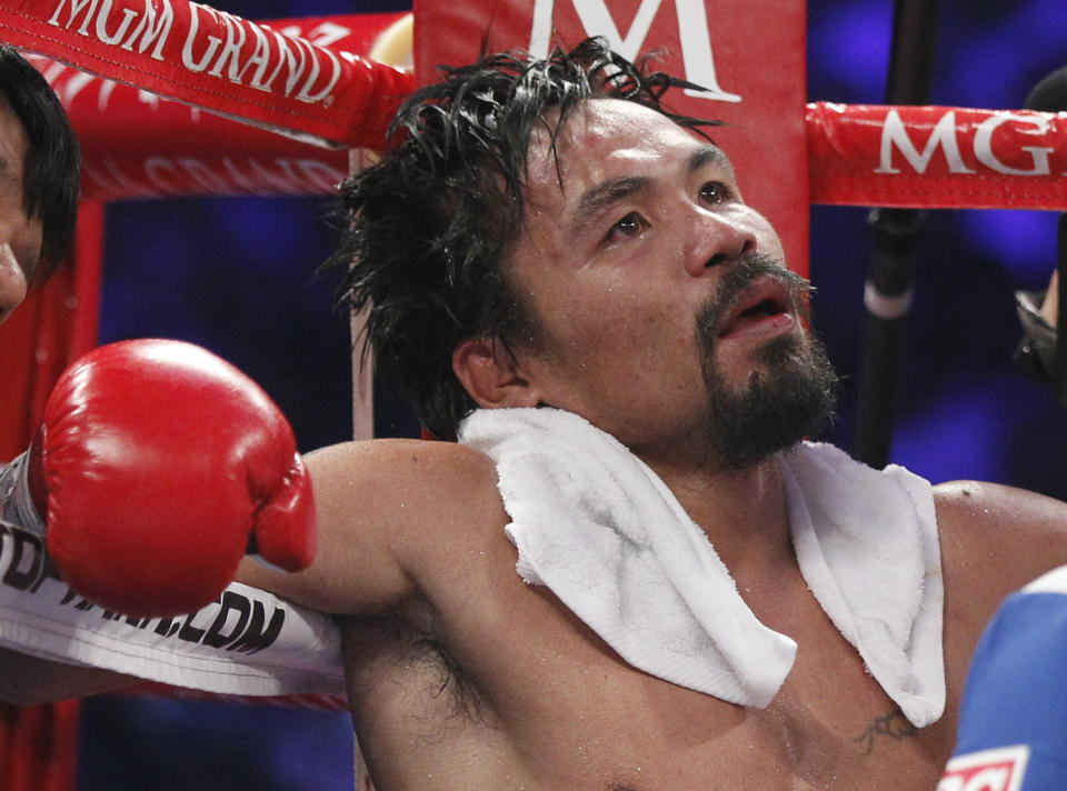 Manny Pacquiao, from the Philippines, sits in his corner following the eleventh round of his WBO welterweight title fight against Timothy Bradley, from Palm Springs, Calif., Saturday, June 9, 2012, in Las Vegas. Bradley won the bout by split decision. (AP Photo/Chris Carlson)