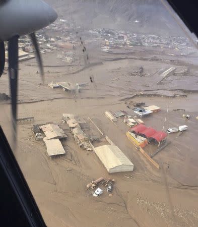 An aereal picture of the town of ChaÃ¢â‚¬â€œaral where a Bell-412 helicopter of the Chilean Air Force (FACH) is pictured rescuing people who were isolated from a severe floods March 26, 2015. REUTERS/FACH/Fuerza Aerea de Chile (Chilean Air Force)/Handout via Reuters