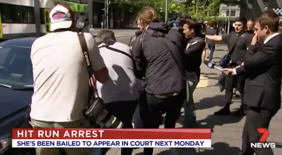 There were chaotic scenes as photographers tried to get a picture of the woman. Source: 7 News