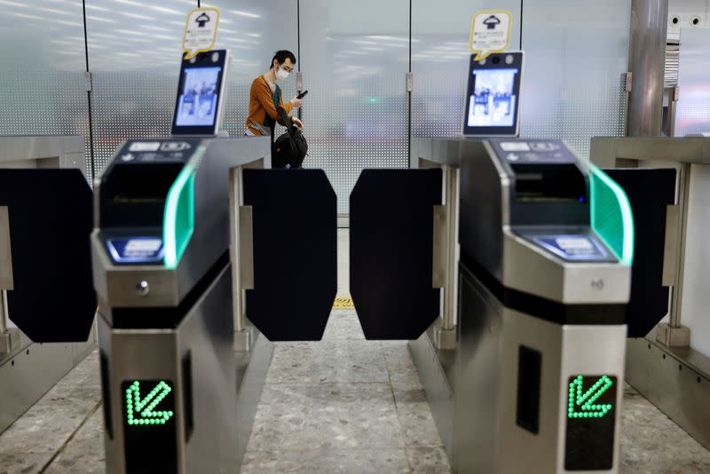 A passenger arrives at West Kowloon High-Speed Train Station Terminus on the first day of the resumption of rail service to mainland China, during the coronavirus disease (COVID-19) pandemic in Hong Kong