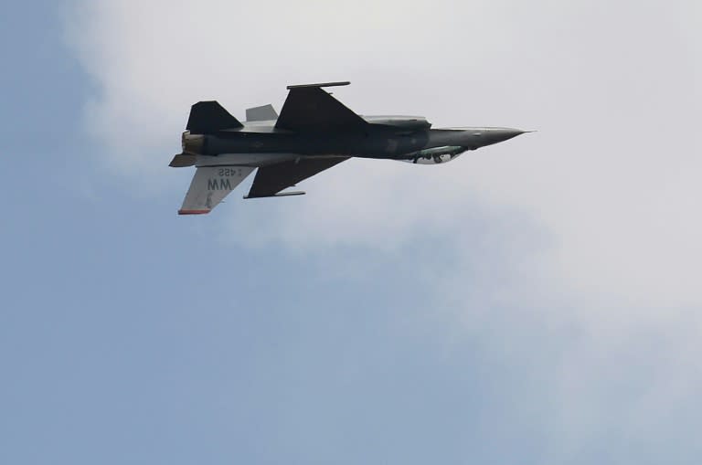 This file photo taken on February 14, 2017 shows a Lockheed Martin F-16 fighter aircraft from the US Air Force performing an aerial display over the skies of Yelahanka Air Force Station on the inaugural day of the 11th edition of Aero India