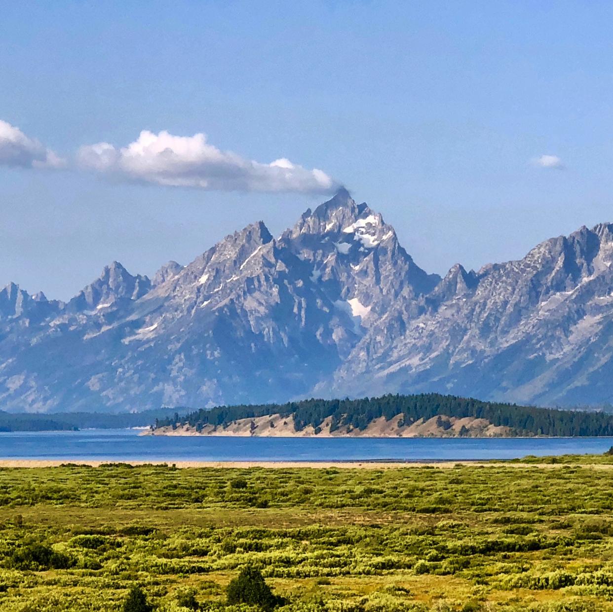 Summer clouds drift over the towering peaks of Grand Teton National Park in this August 2018 file photo.