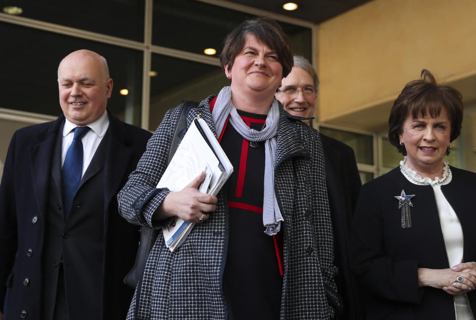 FILE - In this Thursday, April 11, 2019 file photo, Northern Ireland Democratic Unionist Party leader Arlene Foster, center, speaks to journalists after her meeting with European Union chief Brexit negotiator Michel Barnier at EU headquarters in Brussels. Foster, the leader of Northern Ireland announced her resignation on Wednesday, April 28 after party members mounted a push to oust her over her handling of the fallout from Brexit and other issues. Foster said she would step down as leader of the Democratic Unionist Party on May 28 and as First Minister of Northern Ireland at the end of June. (AP Photo/Francisco Seco, File)