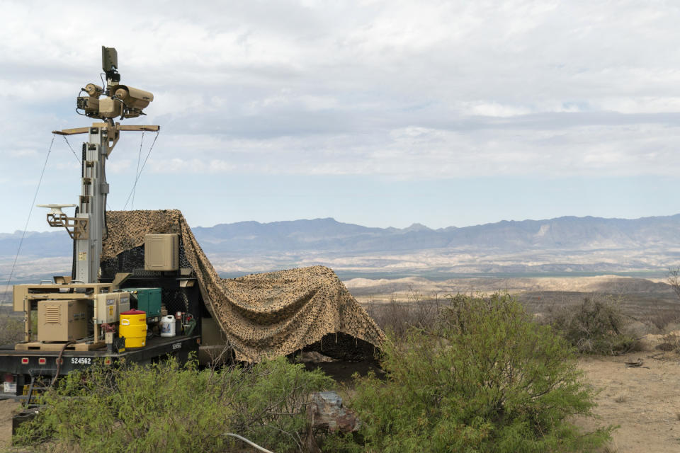 In this April 4, 2019 photo, provided by the U.S. Army, a mobile surveillance camera system manned by soldiers monitors a sector near the Presidio Border Patrol Station at Presidio, Texas. The Trump administration has been quietly adding military surveillance cameras at the U.S.-Mexico border in response to the novel coronavirus pandemic despite the fact fewer people appear to be crossing illegally. Documents obtained by The Associated Press show the Department of Defense at the request of the Department of Homeland Security sent 60 mobile surveillance cameras in addition to 540 more troops to the southwest border this month. (Sgt. Brandon Banzhaf/U.S. Army via AP)