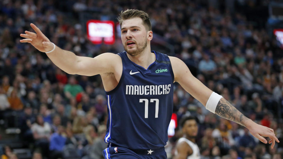 Dallas Mavericks guard Luka Doncic (77) directs his team in the first half during an NBA basketball game against the Utah Jazz Saturday, Jan. 25, 2020, in Salt lake City. (AP Photo/Rick Bowmer)