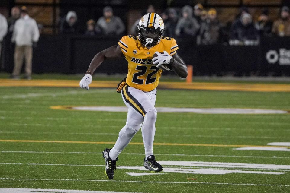 Nov 19, 2022; Columbia, Missouri, USA; Missouri Tigers running back Tavorus Jones (22) runs the ball against the New Mexico State Aggies during the second half at Faurot Field at Memorial Stadium.