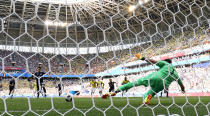 <p>Japan’s Shinji Kagawa scores their first goal from the penalty spot </p>