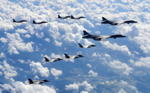 The US flew four stealth fighter jets and two bombers over the Korean peninsula in a show of force after North Korea's latest nuclear and missile tests - Credit: AFP