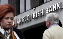 Pedestrians are seen walking past a branch of the Anglo Irish Bank in Dublin in this September 30, 2010 file photograph. REUTERS/Cathal McNaughton/Files