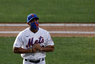 New York Mets manager Luis Rojas walks back to the dugout during the eighth inning of a baseball game against the Atlanta Braves, Saturday, July 25, 2020, in New York. (AP Photo/Adam Hunger)