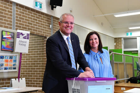Australian Prime Minister Scott Morrison casts his vote alongside wife Jenny, on Election day, at Lilli Pilli Public School, in Sydney, May 18, 2019. AAP Image/Mick Tsikas/via REUTERS