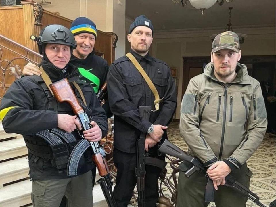 Oleksandr Usyk (second right) while aiding Ukraine’s war effort (Lomus / Instagram)