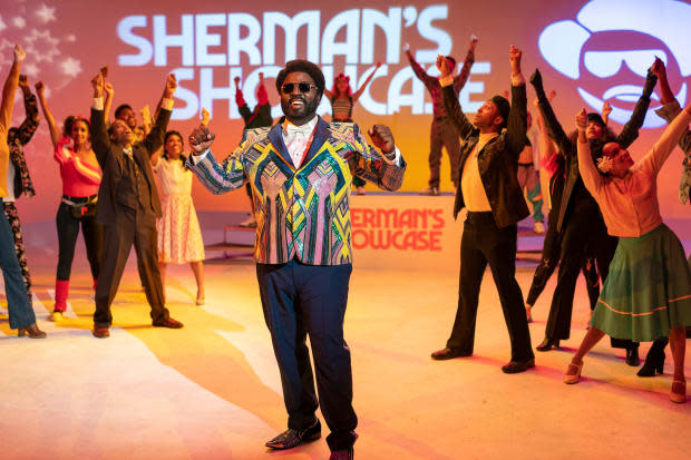 Sherman McDaniels (Bashir Salahuddin), backed by the Showcase Dancers. "I want them to be as famous as The Fly Girls or the Solid Gold Dancers," says Riddle.
