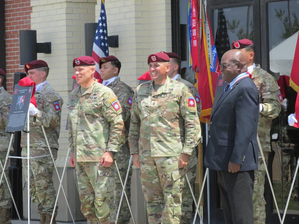 Retired Command Sgt. Maj. Charles Thorpe, far right, is congratulated by  Maj. Gen. Christopher LaNeve, far left and Command Sgt. Maj. Randolph Delapena, second from right, after being inducted into the 82nd Airborne Division Hall of Fame during a ceremony Wednesday, May 24, 2023, at Fort Bragg.