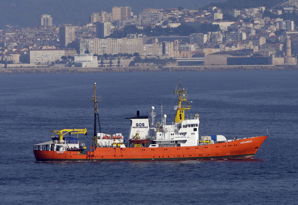 FILE -- In this file photo taken on Aug. 1, 2018, French NGO "SOS Mediterranee" Aquarius ship leaves the Marseille harbour, southern France. Italian prosecutors have ordered the seizure of a migrant rescue ship and accused the aid group Doctors Without Borders of illegally disposing 24 metric tons (26.5 tons) of medical and contaminated waste accumulated during nearly 50 rescues. (AP Photo/Claude Paris)