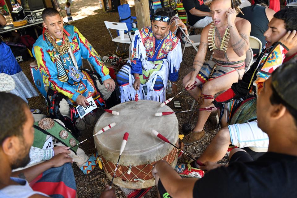 The Red Hawk drum group prepared for a past Mashpee Wampanoag Powwow, which traditionally draws representatives of various tribes and crowds of spectators.