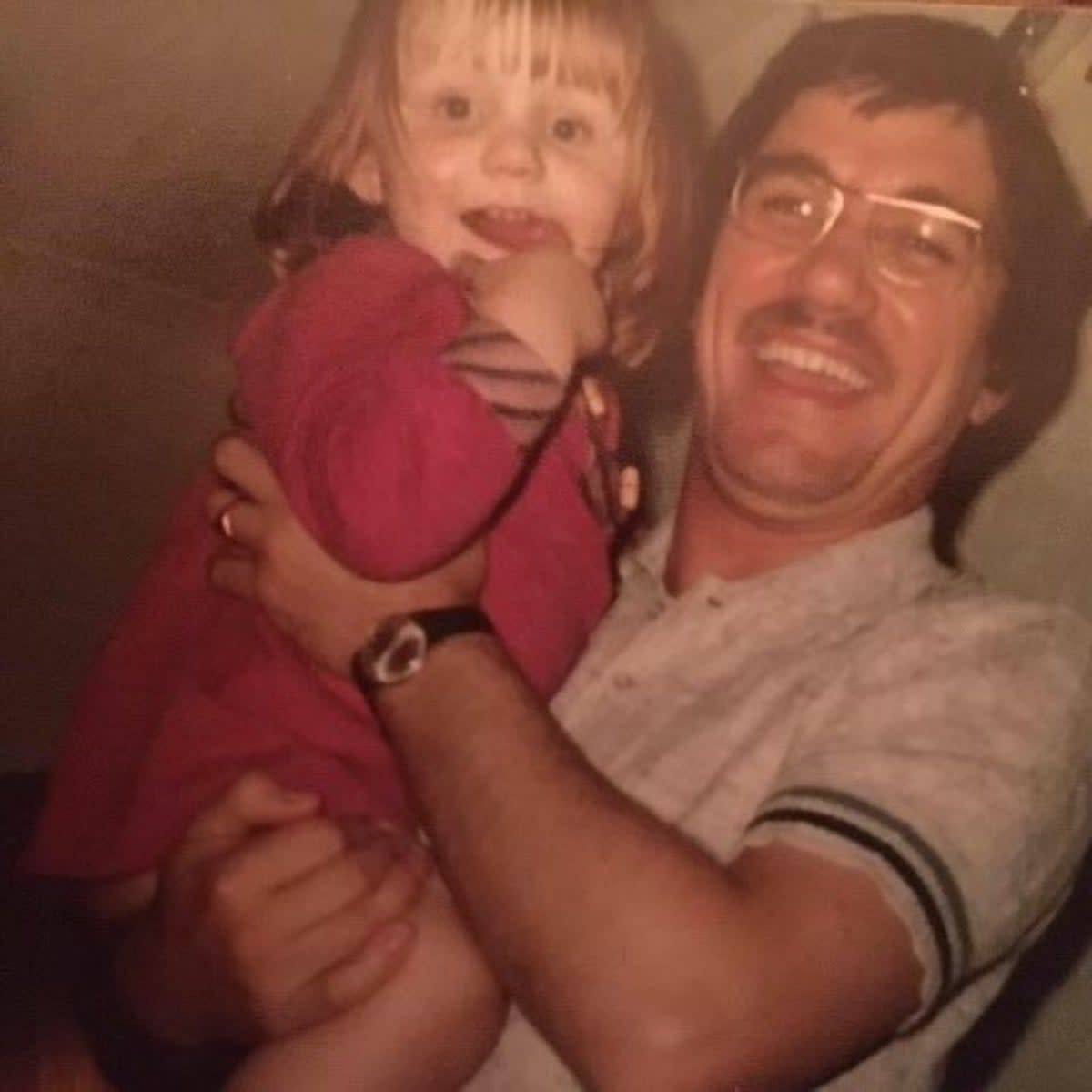 Ms Carney when she was a toddler with her father (Ruth Carney)