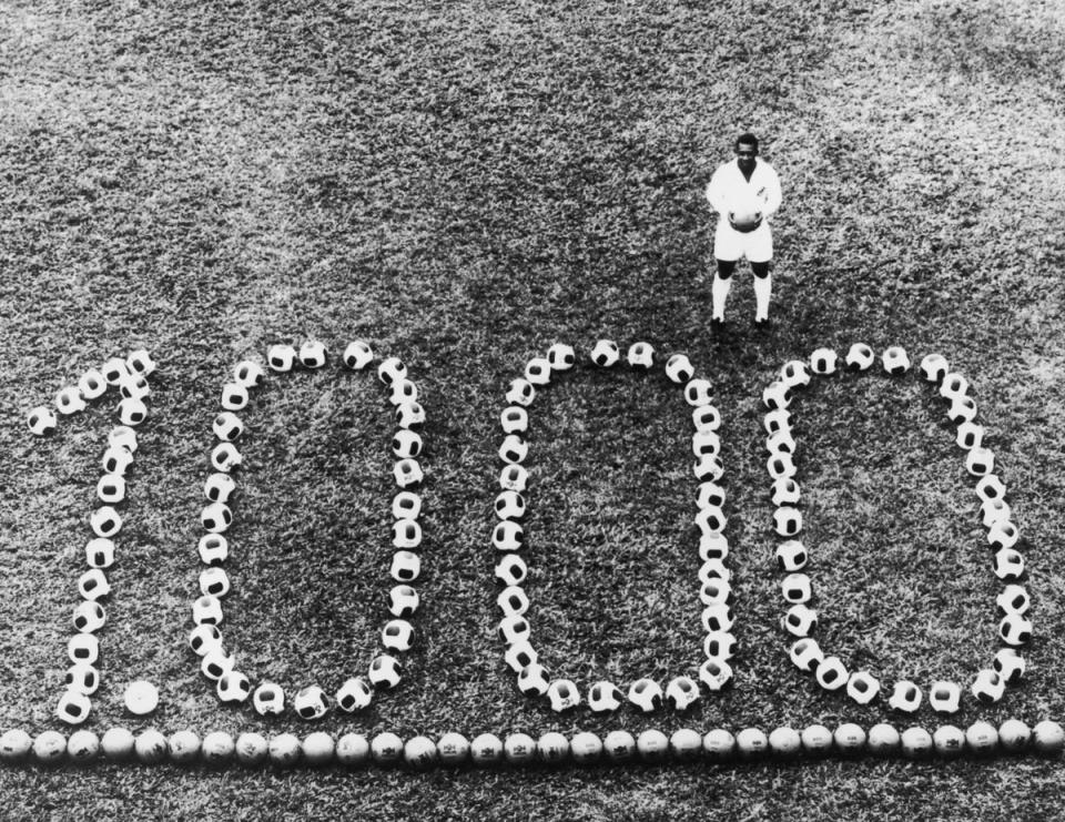 Pele stands by a display to celebrate his 1000th professional goal in 1969 (Getty Images)