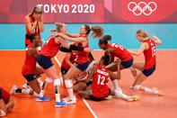 <p>Team USA's women's volleyball team reacts after defeating Team Brazil during the Women's Gold Medal Match, winning their very first gold medal. </p>